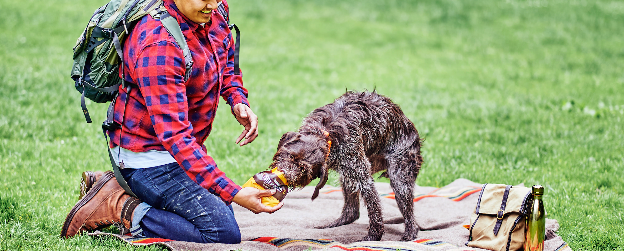 Man gives dog a treat