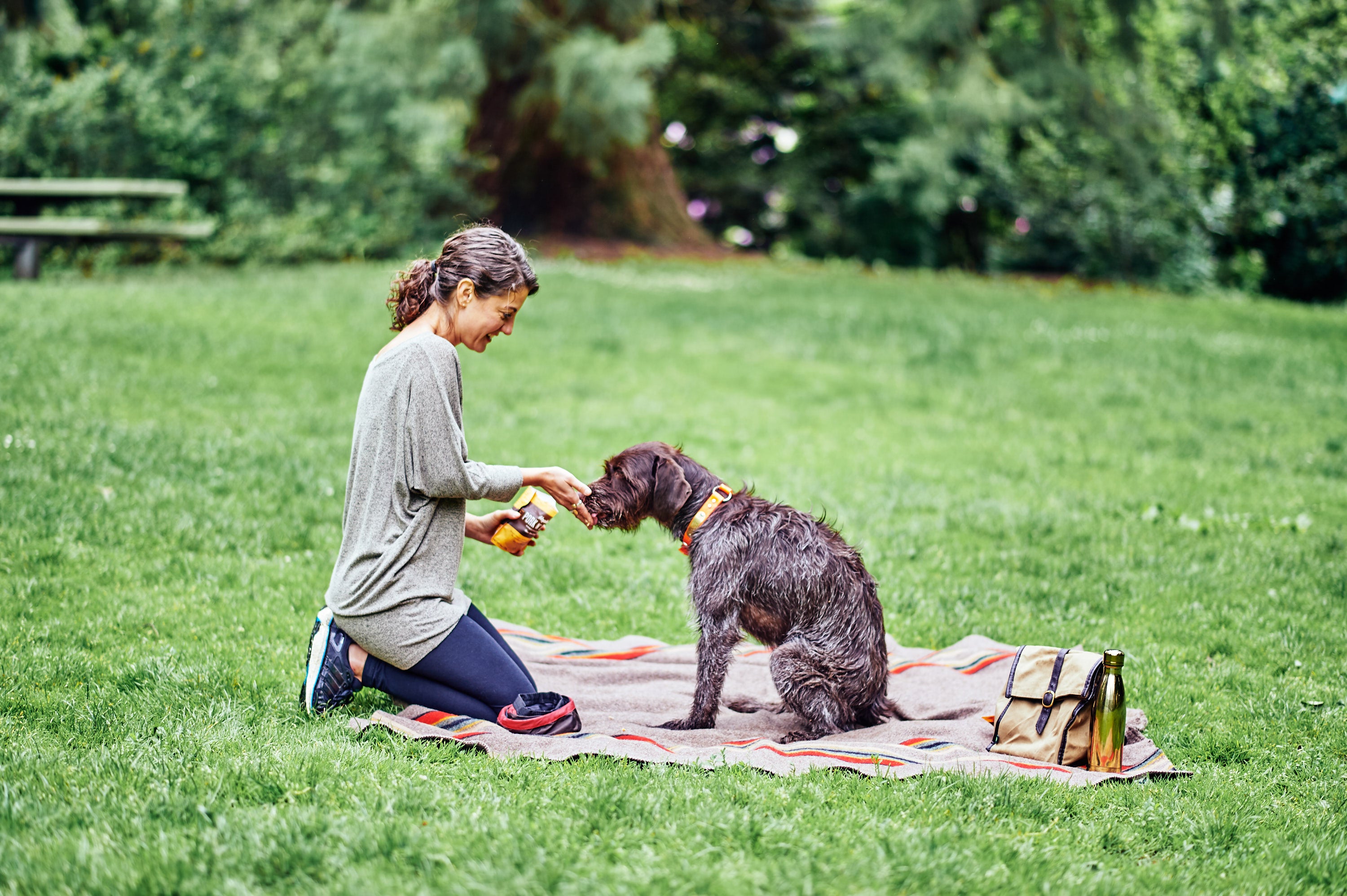 woman dog picnic portland pet food company