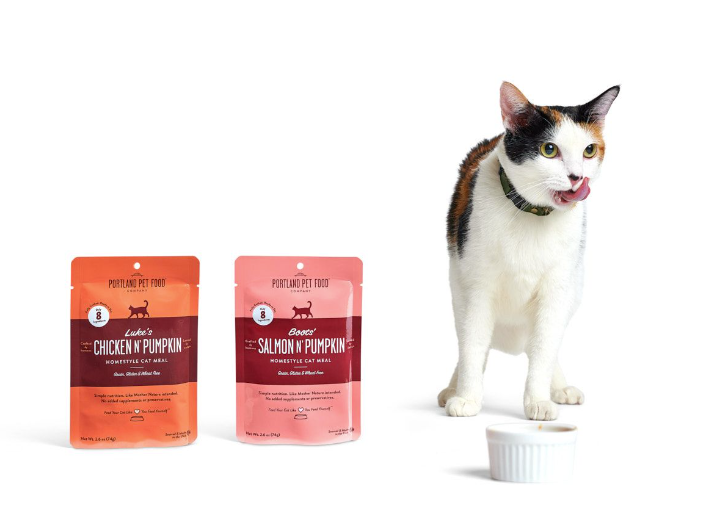A cat enjoying a bowl of Portland Pet Food Company's human-grade wet cat food.